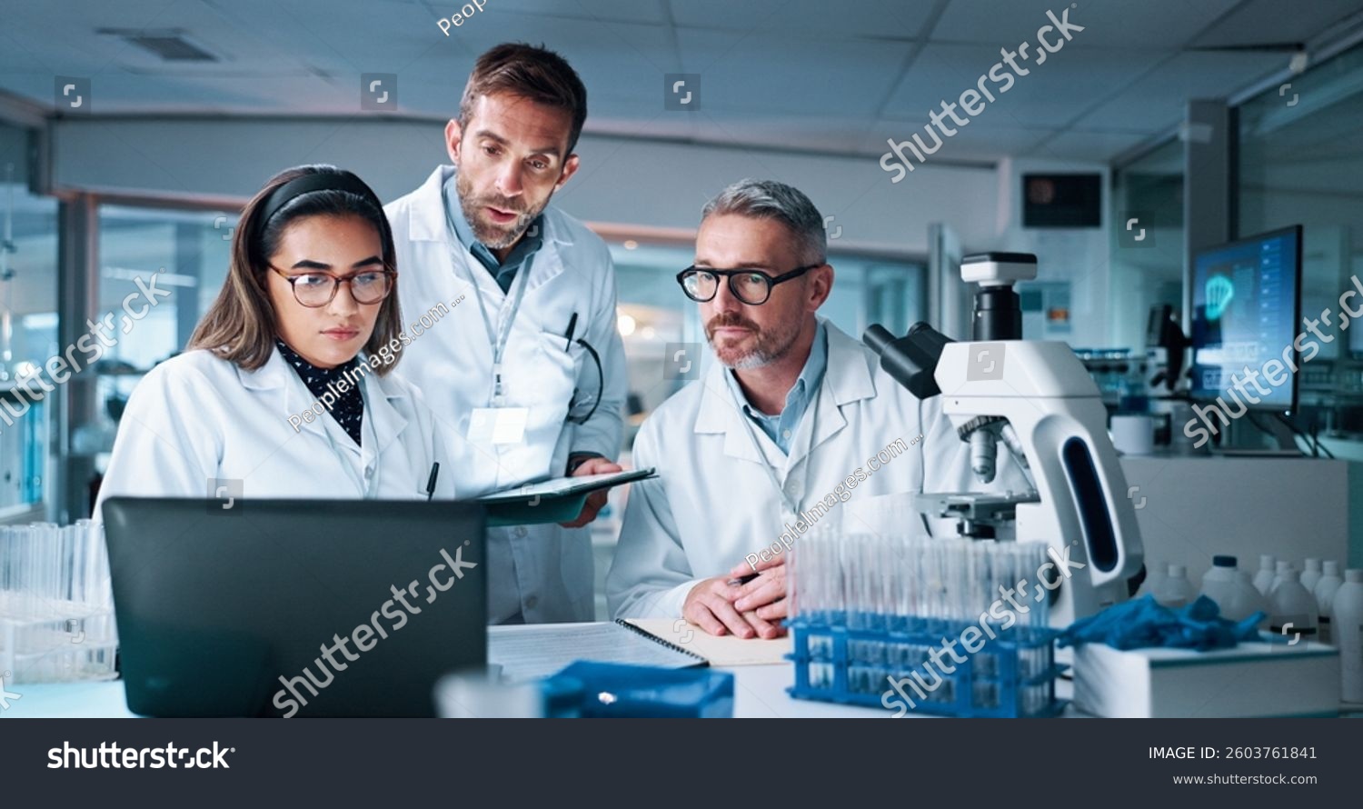 stock-photo-laptop-medical-and-science-with-people-in-laboratory-together-for-breakthrough-or-development-2603761841[1]